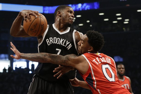Brooklyn Nets forward Joe Johnson (7) drives to the basket against Atlanta Hawks guard Jeff Teague (0) during the first half in Game 3 of a first-round NBA basketball playoff series, Saturday, April 25, 2015, at New York. (AP Photo/Mary Altaffer)