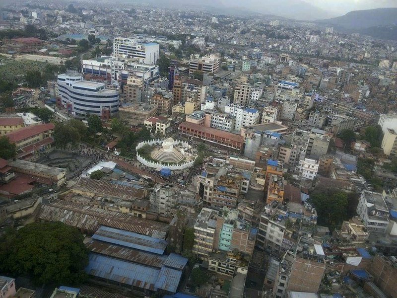 This aerial photo provided by Shreejan Bhandari, shows the historical Dharahara Tower, a city landmark, destroyed by Saturday's earthquake in Kathmandu, Nepal, on Monday, April 27, 2015. A strong magnitude earthquake shook Nepal’s capital and the densely populated Kathmandu valley on Saturday devastating the region and leaving tens of thousands shell-shocked and sleeping in streets. 