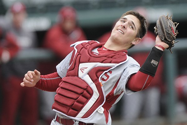 Arkansas catcher Tucker Pennell catches a foul ball during a game against Eastern Illinois on Tuesday, March 3, 2015, at Baum Stadium in Fayetteville. 