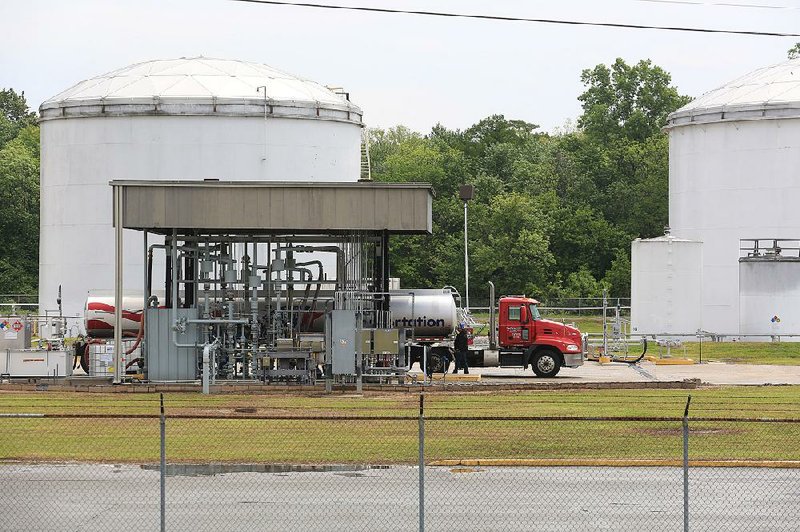 A tanker truck makes a stop at Delek Logistics in the North Little Rock Terminal on Tuesday, where petroleum products are stored for distribution. Oil producers in Arkansas have scaled back operations in response to lower oil prices. 