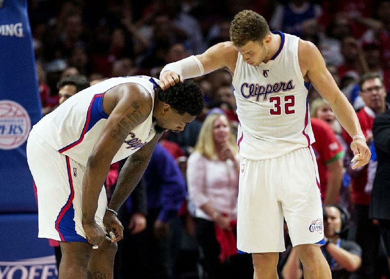 Los Angeles Clippers players DeAndre Jordan (left) and Blake Griffin combined for 51 points, 28 rebounds and 3 blocked shots, but it wasn’t enough to push their team past San Antonio on Tuesday night. 