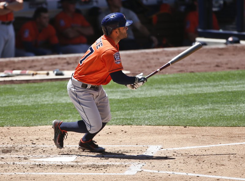 Houston Astros' Jose Altuve watches his deep sacrifice fly to left that drove in Jake Marisnick from third base in the third inning of a baseball game against the San Diego Padres Wednesday April 29, 2015 in San Diego. 
