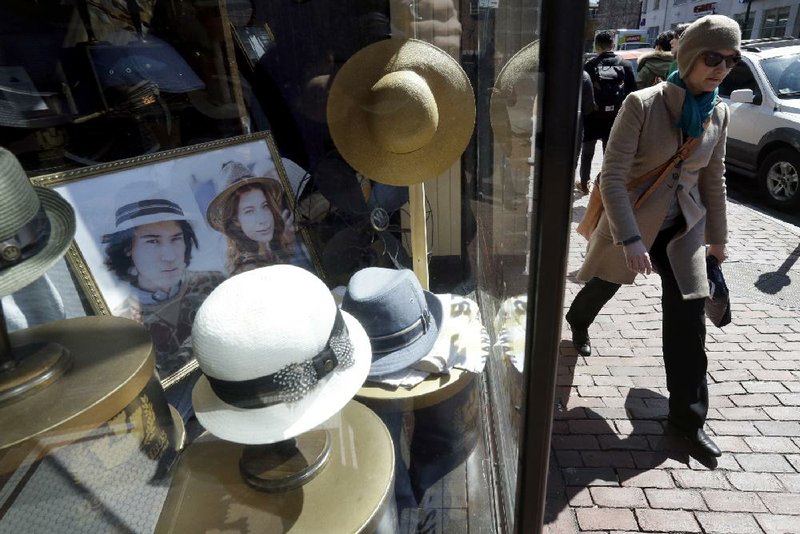 Hats are displayed at a store in the Harvard Square neighborhood of Cambridge, Mass., in early April. March’s consumer spending gain of 0.4 percent was the strongest since November. 