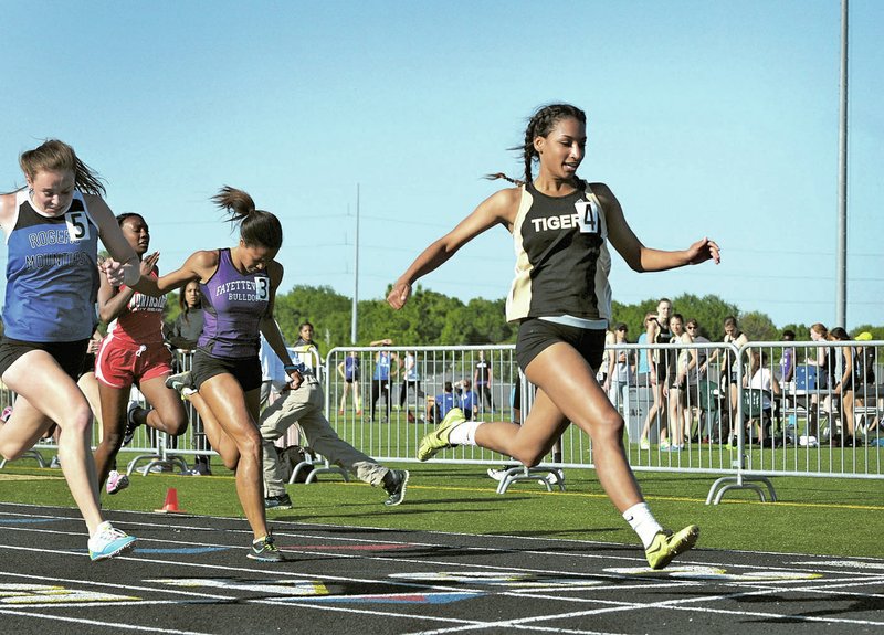  NWA Democrat-Gazette/BEN GOFF Taylor Mahone of Bentonville wins the 100-meter dash with a time of 12.04 seconds during Thursday&#8217;s 7A-West conference meet at the Tiger Athletic Complex in Bentonville.