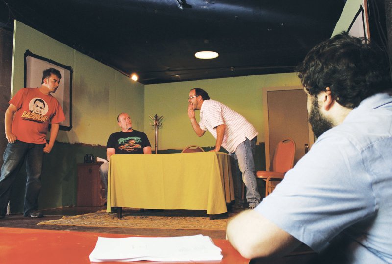 Playwright Samuel Brett Williams, right, watches a rehearsal of Derby Day on April 20 at Low Key Arts in Hot Springs. Set in a luxury box at Oaklawn Park, the play has been produced in Los Angeles and New York City. It was presented to Arkansas audiences for the first time on Thursday. It is produced by Red Door Studios with Williams directing.