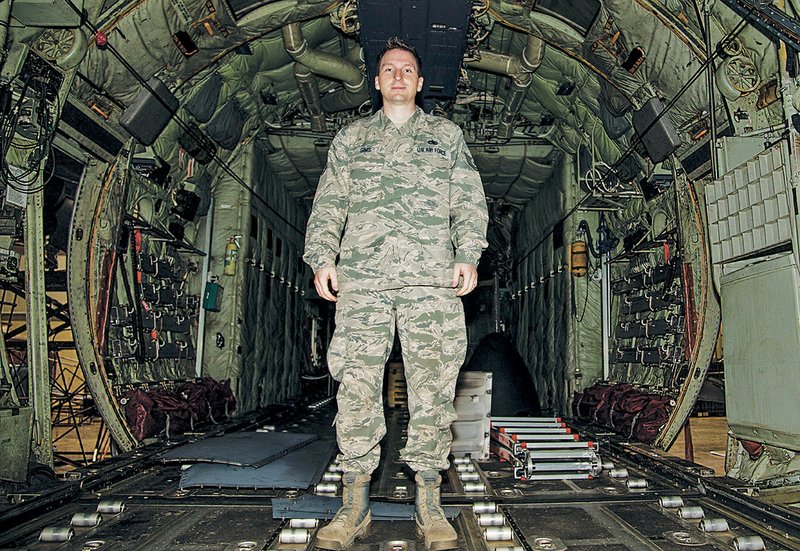 Tech. Sgt. Eric Sims, a 314th Aircraft Maintenance Squadron hydraulic systems craftsman, stands in the back of a C-130H on April 17 at the Little Rock Air Force Base. Sims was awarded the 2014 Air Force Lt. Gen. Leo Marquez Maintenance Award.