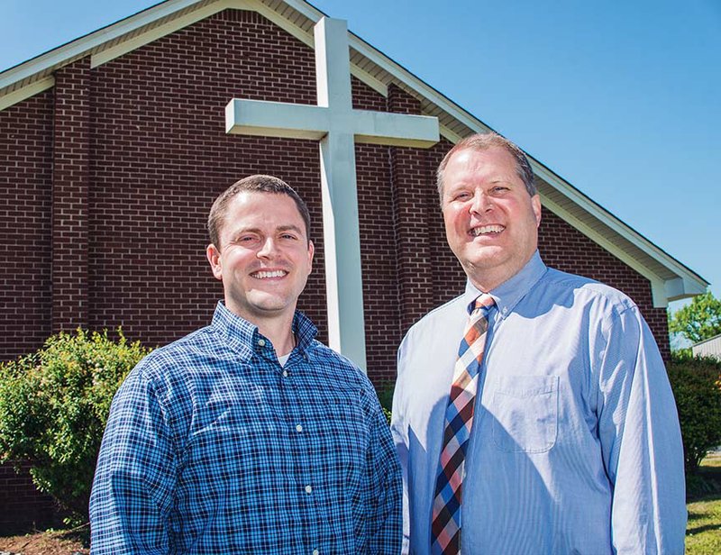 The Revs. Kyle Reno, lead pastor, left, and Mike Ford stand outside The Summit Church at 1905 Dave Ward Drive in Conway. The building was home to Cornerstone Bible Church, but Ford, who was Cornerstone’s pastor, and his congregation gave the building to The Summit Church, which is new to Conway. Cornerstone members became part of The Summit Church in an arrangement that both men said is unprecedented.