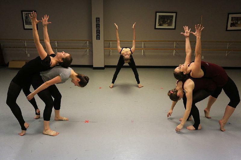 Dancers with New Creation Dance Company rehearse at Sonshine Academy in Conway on Tuesday. The dance troupe includes (left to right) Kayla Derrick, Laurel Simon, Kathleen Marleneanu, Greta Smith and Erin Sanders.  
