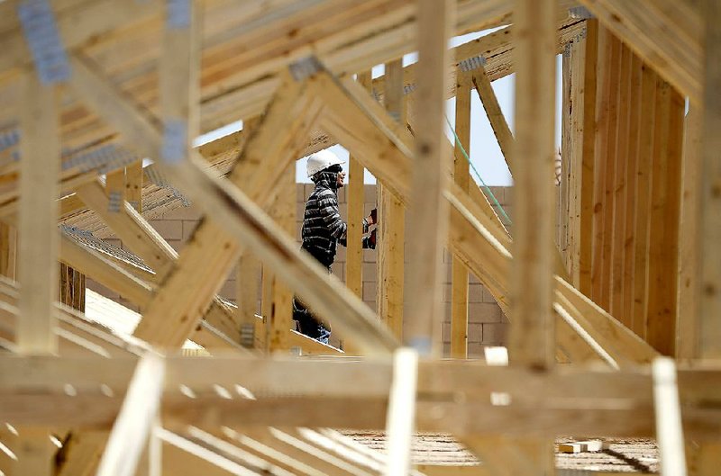 A framer works last month on a new house in Las Vegas. Construction spending fell 0.6 percent in March after a flat reading in February, the Commerce Department reported Friday. 