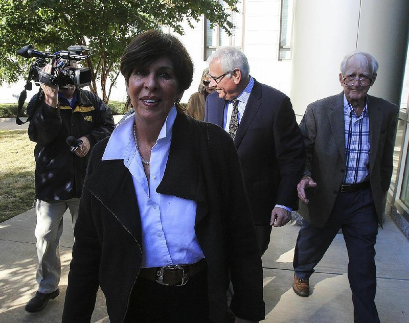 In this file photo former Arkansas State Treasurer Martha Shoffner (left) is shown with her attorney Chuck Banks (middle) at the federal courthouse in Little Rock.