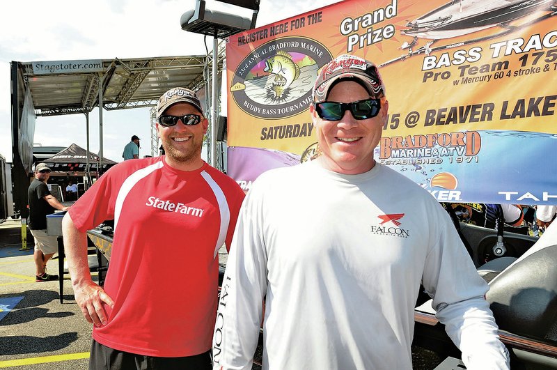  NWA Democrat-Gazette/FLIP PUTTHOFF Steven Meador (left) and Aaron Stanphill, both of Bella Vista, pose with the Tracker bass boat, motor and trailer they won for first place at the Rogers-Lowell Area Chamber of Commerce buddy bass tournament.