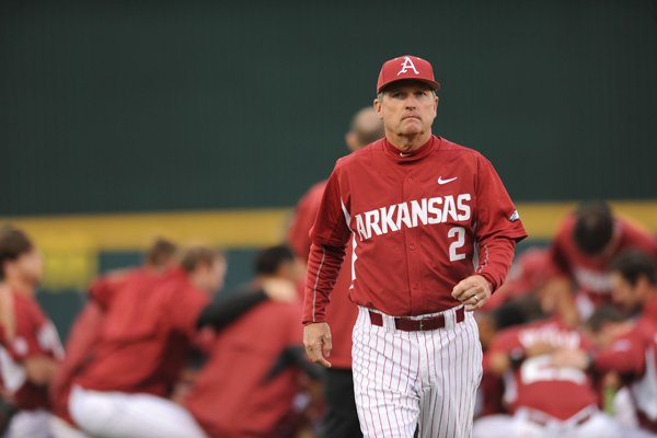 Arkansas coach Dave Van Horn walks away from a team huddle before the Razorbacks' game against Mississippi State on Friday, April 24, 2015, at Baum Stadium.