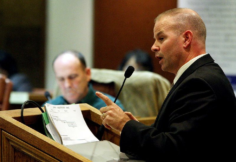 12/13/10
Arkansas Democrat-Gazette/STEPHEN B. THORNTON
Derek Scott, Executive Director of Operations, explains components of the Vison 2020 facilities plan during a Pulaski County Special School District board workshop Monday evening.