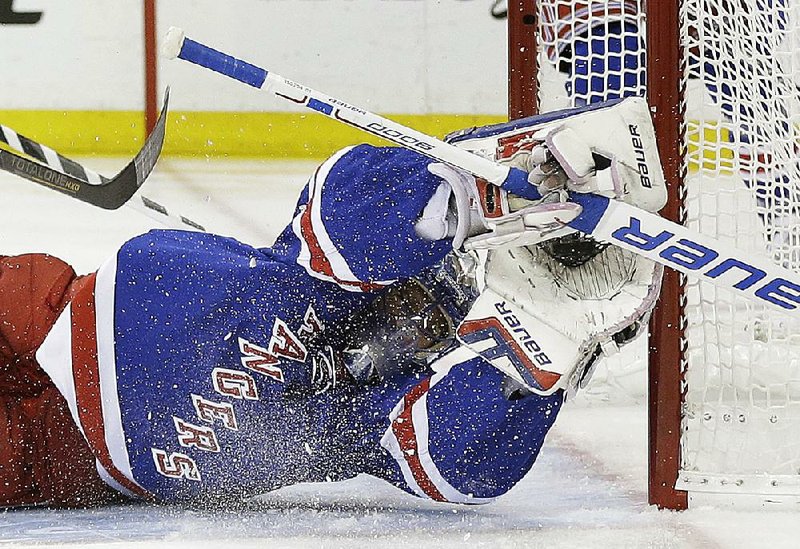 New York Rangers goalie Henrik Lundqvist (30) makes a diving save on a shot by Washington Capitals left wing Alex Ovechkin during the first period of Game 2 in the second round of the NHL Stanley Cup hockey playoffs Saturday, May 2, 2015, in New York. (AP Photo/Frank Franklin II)