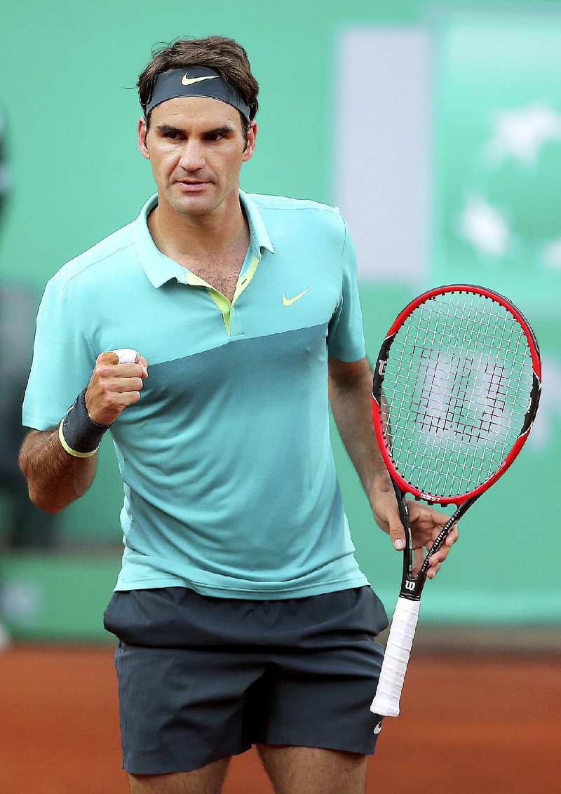 Roger Federer of Switzerland celebrates a point during the final match of the Istanbul Open tennis tournament against Pablo Cuevas of Uruguay, at Garanti Koza Arena in Istanbul, Turkey, Sunday, May 3, 2015. The Istanbul Open was the first ever ATP World Tour event in Turkey. (AP Photo)