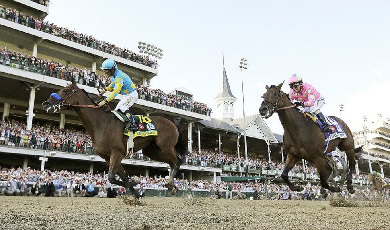 Victor Espinoza rides American Pharoah to victory in the 141st running of the Kentucky Derby horse race at Churchill Downs Saturday, May 2, 2015, in Louisville, Ky. (AP Photo/David J. Phillip)