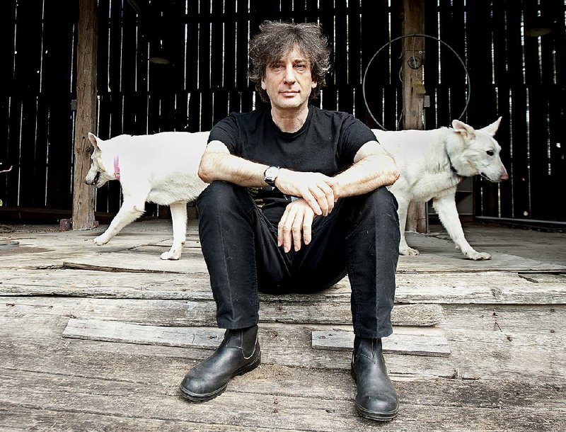 **CORRECTS LOCATION** In this April 23, 2010 photo, best-selling author Neil Gaiman, 49, sits at an old barn near his writing gazebo at his home in western Wisconsin.  (AP Photo/Craig Lassig)