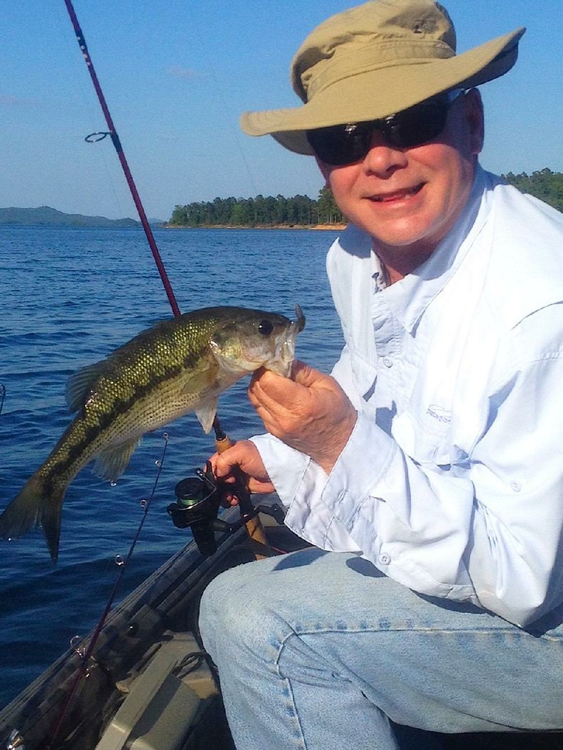 Arkansas Democrat-Gazette/BRYAN HENDRICKS
Rusty Pruitt of Bryant used a Zoom Tiny Lizard to catch this chunky spotted bass Thursday on a gorgeous day at Lake Ouachita.
