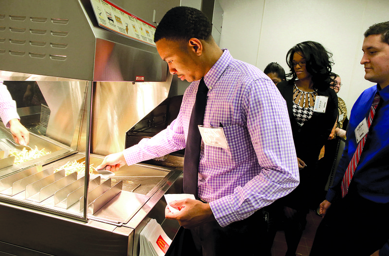 McDonald’s restaurant general manager Joseph Ellis dishes out fries in the Food Quality Lab at
Hamburger University in Oak Brook, Ill. in mid-April.
