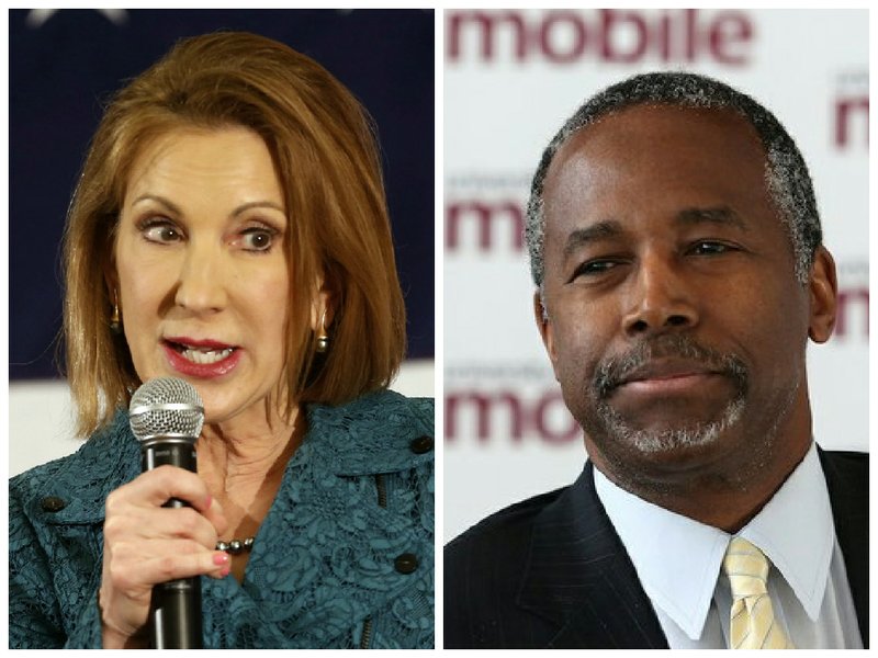 Former technology executive, Carly Fiorina, left, and retired surgeon Ben Carson formally entered the 2016 presidential race on Monday. Both candidates are entering the GOP's presidential primary. (AP Photo/Jim Cole)(MIKE BRANTLEY/AL.COM VIA AP)