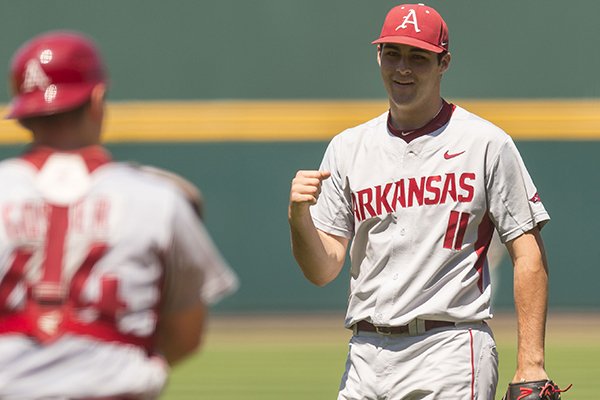 Arkansas pitcher Keaton McKinney (11) pumps his fist after finishing a 2-hit shutout in a 4-0 win over Alabama in an NCAA college baseball game, Saturday, May 2, 2015, at the Hoover Met in Birmingham, Ala. (Vasha Hunt/AL.com via AP)