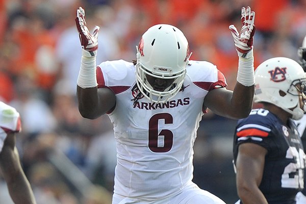 Arkansas defensive end JaMichael Winston celebrates a tackle during a game against Auburn on Saturday, Aug. 30, 2014, at Jordan-Hare Stadium in Auburn, Ala.