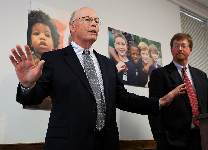 Baker Kurrus (left), with state Education Commissioner Johnny Key, said Tuesday at the Little Rock School District Administration Building that he has “big ears” and will listen to all sides and won’t impose any “my way or the highway” ultimatums as superintendent. 