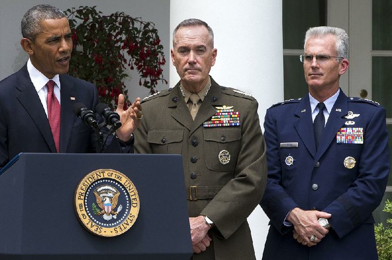 Marine Gen. Joseph Dunford Jr. (center), with Air Force Gen. Paul Selva, listens as President Barack Obama announces that he will nominate Dunford as the next chairman of the Joint Chiefs of Staff and Selva as the vice chairman on Tuesday in the Rose Garden of the White House.