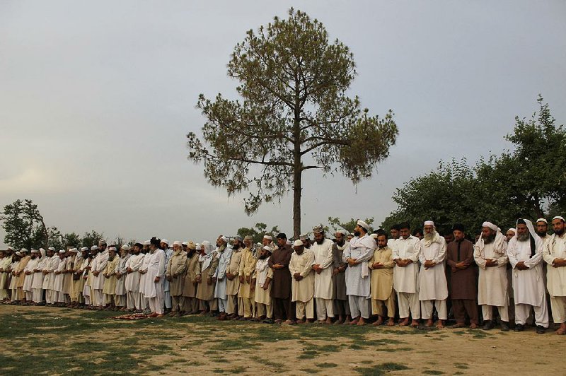 Pakistanis hold a special prayer service Tuesday in Peshawar for the two gunmen killed Sunday by police in Garland, Texas, after the men opened fire outside an event where cartoons depicting the Prophet Muhammad were featured. 