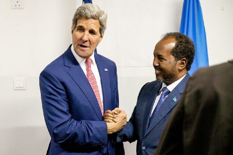 Secretary of State John Kerry is greeted by President Hassan Sheikh Mohamud at the airport in Mogadishu, Somalia, on Tuesday in a show of solidarity with the Somalian government trying to defeat al-Qaida-allied militants and end decades of war in the African country. 