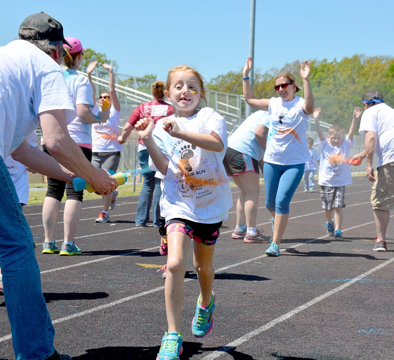 Photo by Janelle Jessen Gentry Primary School students raced in a color run on Friday afternoon. The event was held as a fundraiser for the Parent Teacher Organization and to promote fitness for students.