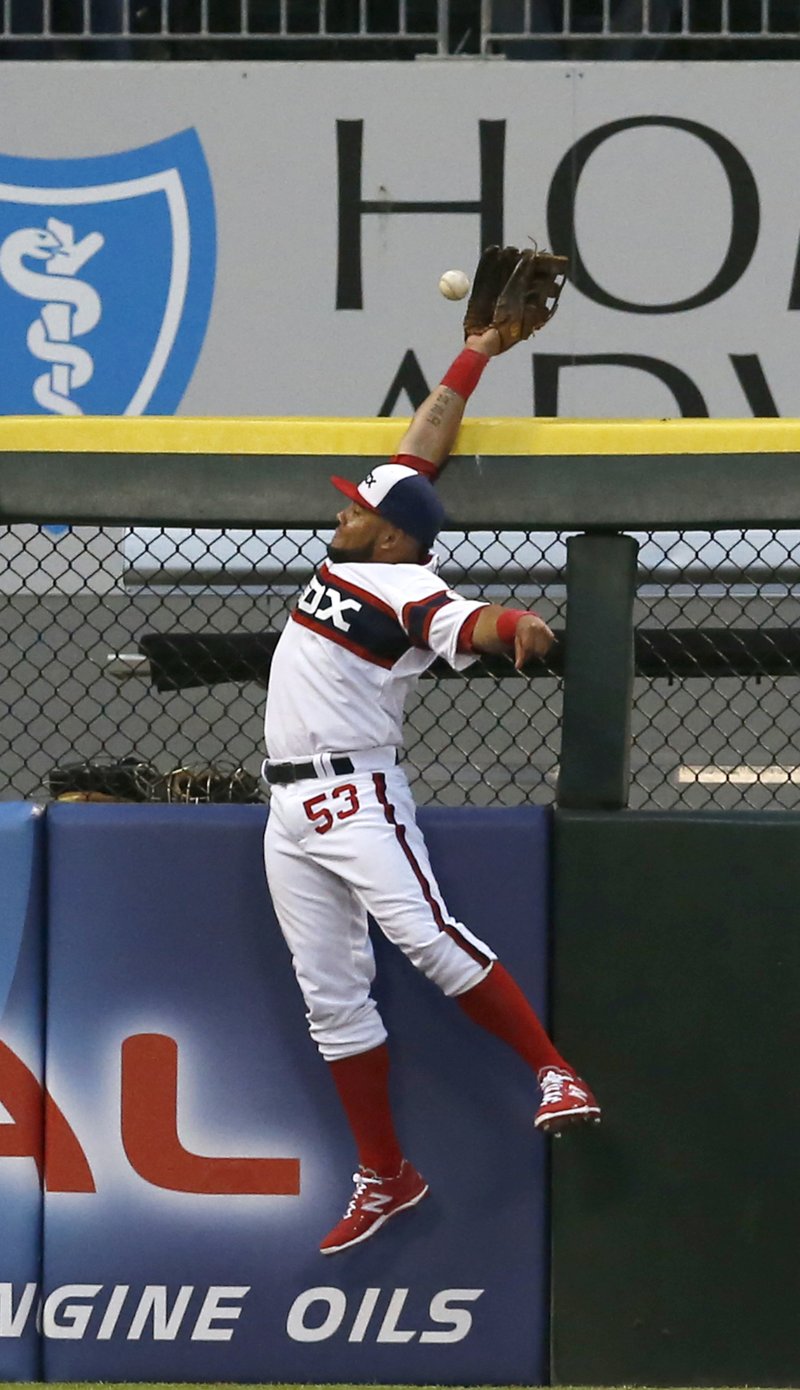 Chicago White Sox left fielder Melky Cabrera is unable to catch Detroit Tigers' Alex Avila's home run during the second inning of a baseball game Tuesday, May 5, 2015, in Chicago. 