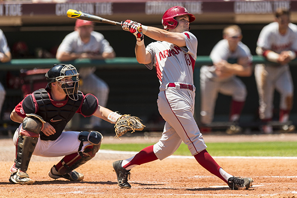 June 13, 2015: Arkansas outfielder Andrew Benintendi #16 is greeted by  teammates after his home run in action during game 1 of the 2015 NCAA Men's  College World Series between Virginia Cavaliers