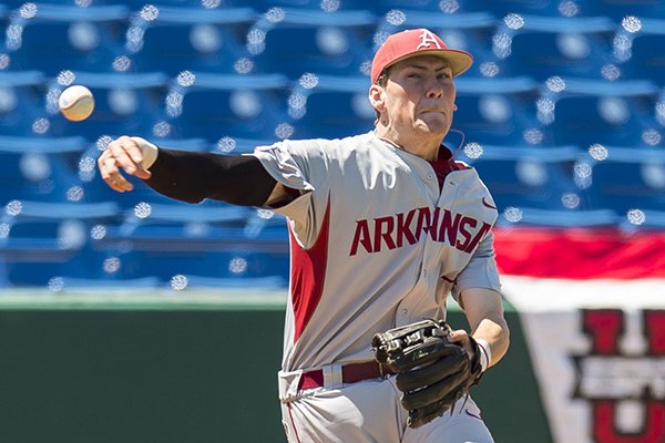 Arkansas infielder Bobby Wernes (7) makes an acrobatic throw from third base to record an out in the eighth inning against Alabama during an NCAA college baseball game, Saturday, May 2, 2015, at the Hoover Met in Birmingham, Ala. (Vasha Hunt/AL.com via AP)