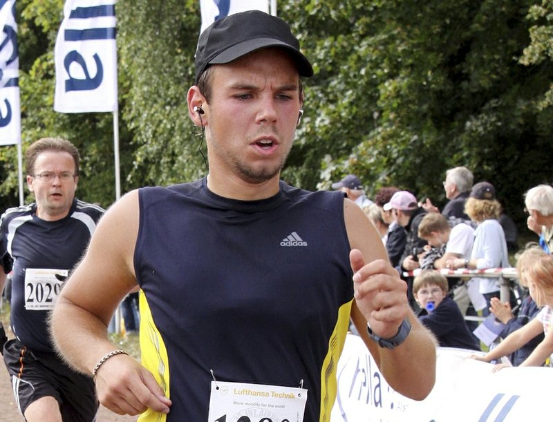 In this Sunday, Sept. 13, 2009, photo, Andreas Lubitz competes at the Airportrun in Hamburg, northern Germany. Lubitz the co-pilot of Germanwings Flight 9525 appeared to have practiced a controlled descent on his flight into Barcelona just two hours before he intentionally crashed the A320 jet into a mountainside on the return flight to Dusseldorf, air accident investigators said Wednesday, May 6, 2015.