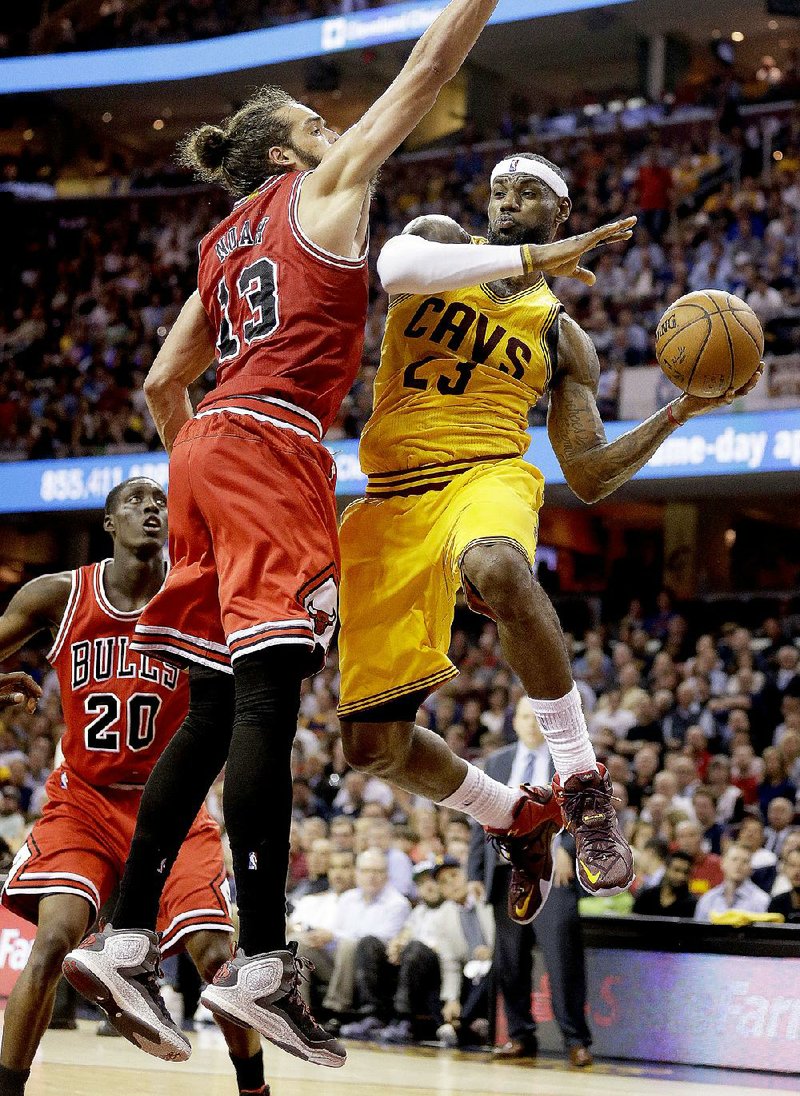 LeBron James (right) had 33 points, 8 rebounds and 5 assists to lead the Cleveland Cavaliers to a 106-91 victory over the Chicago Bulls on Wednesday night in Game 2 of their NBA Eastern Conference semifinal series.