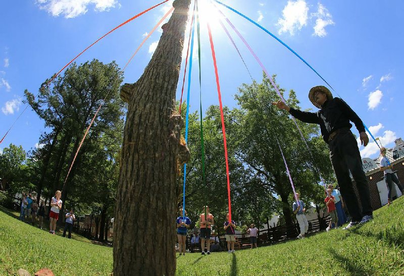 Maypole dancing, stilt walking and other pioneer games are part of the fun at the Historic Arkansas Museum’s annual Territorial Fair. 