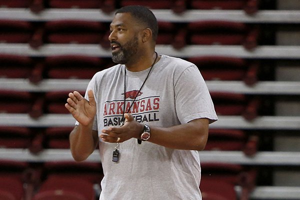 Arkansas student assistant coach Lee Mayberry watches practice Tuesday, Oct. 7, 2014, at Bud Walton Arena in Fayetteville. Mayberry will graduate from the University of Arkansas on Saturday, nearly 27 years after enrolling at the school.