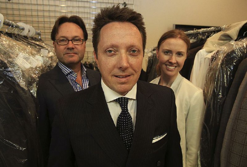 Arkansas Democrat-Gazette/STATON BREIDENTHAL --5/7/15-- Jamie Davidson (middle) Sean Cullers (left) and Erin Holifield of Strong Suit clothing brand in their Little Rock office. 
