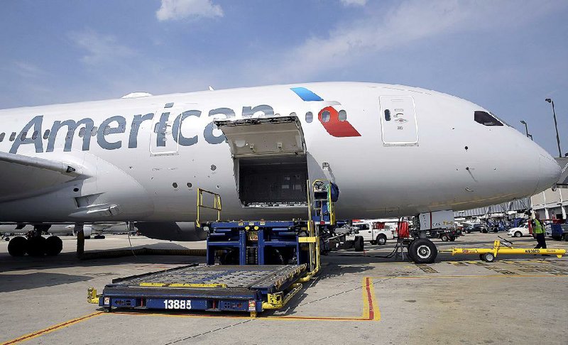 American Airlines' first Boeing 787 Dreamliner is parked at O'Hare International Airport Thursday, May 7, 2015, in Chicago. American joins United as the only U.S. airlines using the plane, which the airline hopes will appeal to passengers and open new, profitable international routes. (AP Photo/Nam Y. Huh)