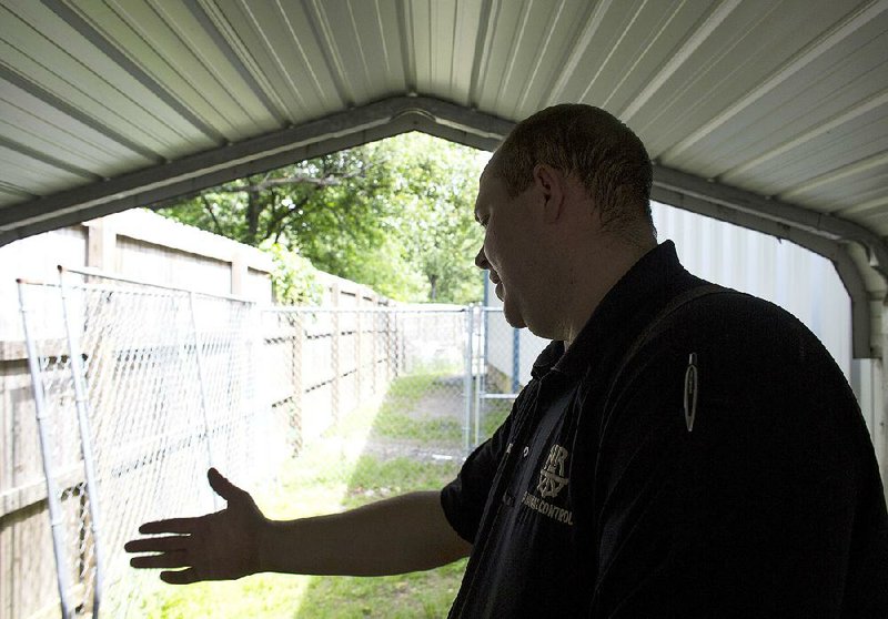 Arkansas Democrat-Gazette/MELISSA SUE GERRITS - 05/08/15 - Animal Control Officer Adam Tindall speaks about the need for renovations at the North Little Rock Animal Shelter May 8, 2015. Tindall and volunteers emphasized the need for concrete in the animal welcoming area and other details that will increase adoptions. 