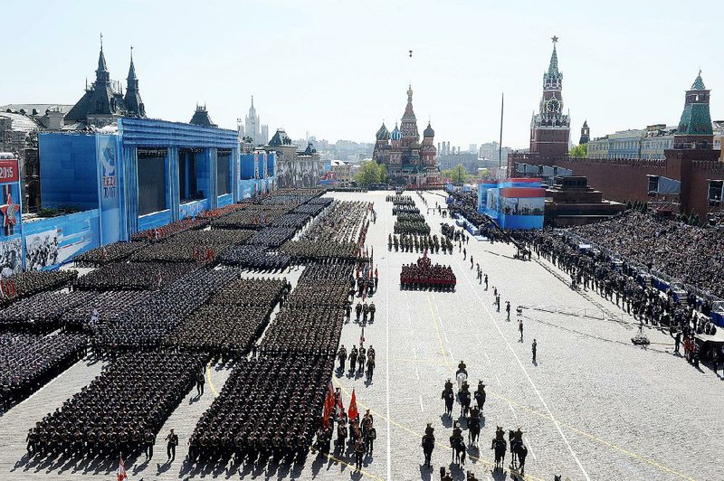 The Victory Parade marking the 70th anniversary of the defeat of the Nazis in World War II, is held in Red Square, with the Kremlin, right, and St. Basil Cathedral, back, in Moscow, Russia, Saturday, May 9, 2015. (Host photo agency/RIA Novosti Pool Photo via AP)