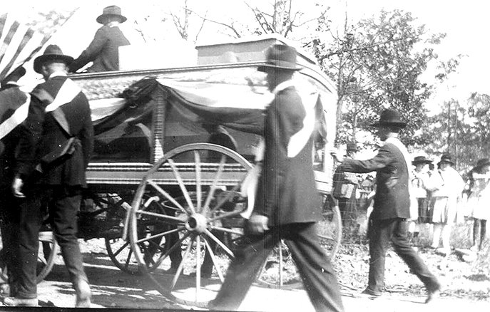 Courtesy Abby Burnett Mourners walk beside the coffin of a Eureka Springs man who died of measles during the Civil War. Because he was buried in a metal coffin with a window, when he was exhumed in 1911 to be interred with his just-deceased wife, his children were able to see his face for a final time.