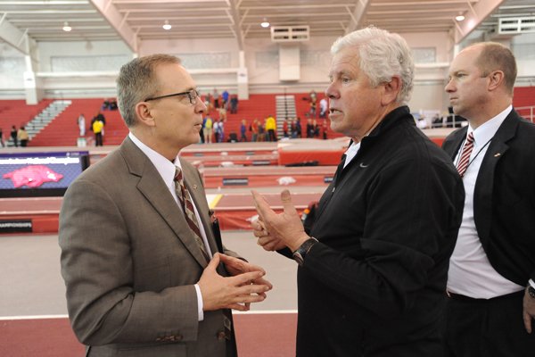 Arkansas women's track and field coach Lance Harter talks to athletic director Jeff Long at the NCAA Indoor Championship Saturday, March 14, 2015 at the Randal Tyson Track Center.