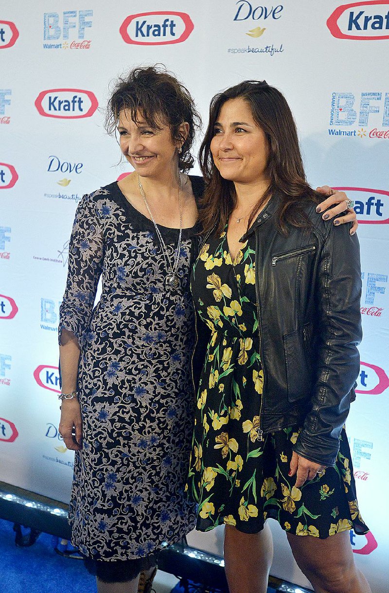 Janet Grillo (left), director of the movie Jack of the Red Hearts, and Jennifer Deaton, the film’s screenwriter, arrive at the Closing Ceremony Blue Carpet and Awards for the Bentonville Film Festival at Grace Point Church on Friday. The film won the Jury Award. 