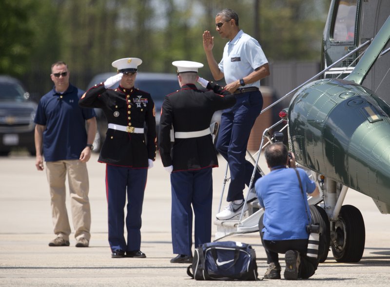 In a Sunday, May 3, 2015 file photo, President Barack Obama salutes as he steps off of Marine One, in Andrews Air Force Base, Md., as he returns from the presidential retreat at Camp David, Md.  Persian Gulf leaders unnerved by Washington's nuclear talks with Iran and Tehran's meddling across the Mideast look to President Barack Obama to promise more than words and weapons at the Camp David summit on Thursday, May May 14. They want commitments from Obama that the United States has their backs at a time when the region is under siege from Islamic extremists, Syria continues to unravel, Iraq is volatile and Yemen is in chaos.
