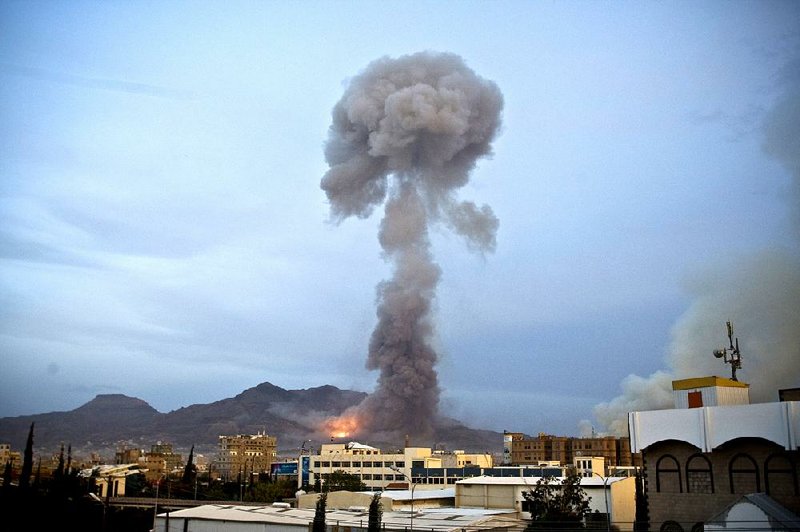 Smoke rises from Sanaa, Yemen, on Monday after a Saudi-led airstrike hit a site believed to be a munitions depot. The bombing unleashed a series of explosions that caused shells to hit residential areas and start fires. 