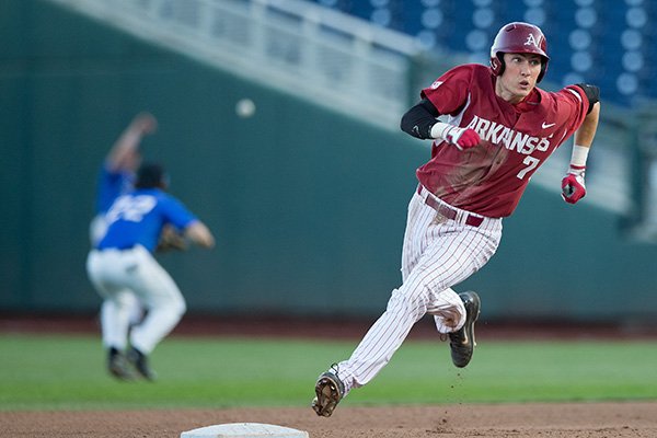 Arkansas' Bobby Wernes rounds the bases after hitting a triple in the sixth inning of a game against Creighton on Tuesday, May 12, 2015, at TD Ameritrade Park in Omaha, Neb. (Mark Davis/Omaha World-Herald)
