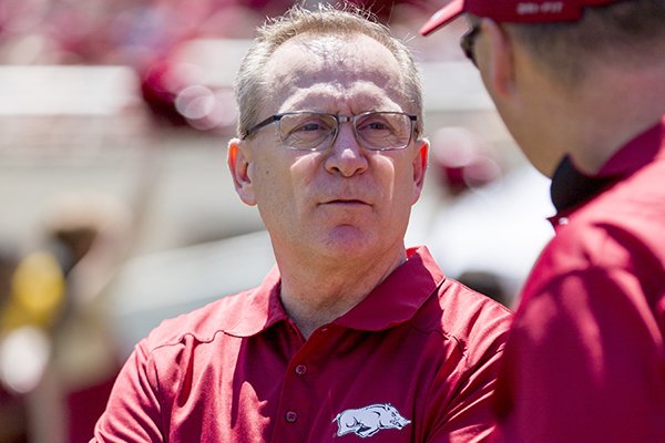 Arkansas athletic director Jeff Long stands on the sidelines before their spring NCAA college football game, Saturday, April 25, 2015, in Fayetteville, Ark. (AP Photo/Gareth Patterson)