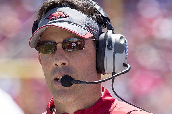 Arkansas offensive coordinator Dan Enos calls a play during the Razorbacks' spring NCAA college football game Saturday, April 25, 2015, in Fayetteville, Ark. (AP Photo/Gareth Patterson)